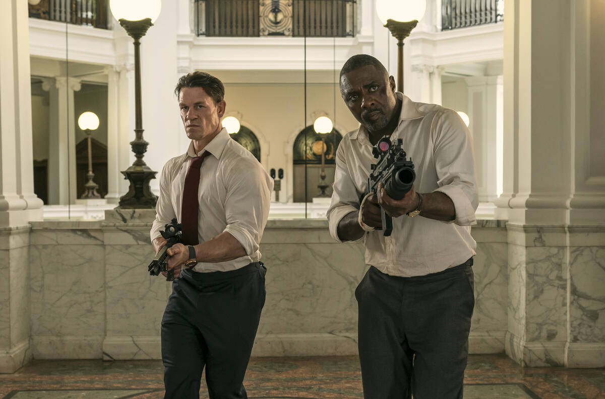This image released by Prime shows John Cena, left, and Idris Elba in a scene from "Heads ...
