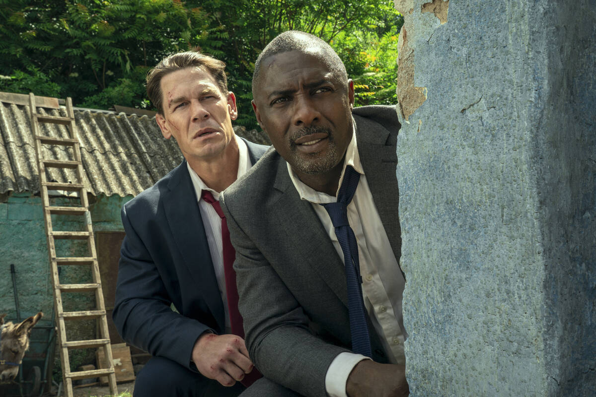This image released by Prime shows John Cena, left, and Idris Elba in a scene from "Heads ...