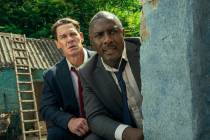 This image released by Prime shows John Cena, left, and Idris Elba in a scene from "Heads ...