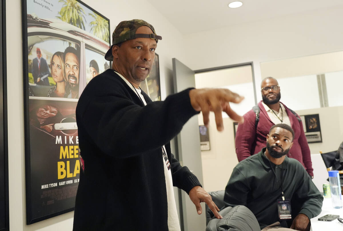 Filmmaker and former professional basketball player Deon Taylor, left, discusses the movie indu ...