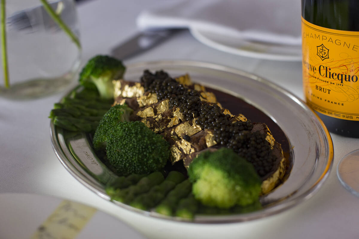 The gold-encrusted filet mignon at Mr. Chow at Caesars Palace hotel-casino in Las Vegas, is see ...
