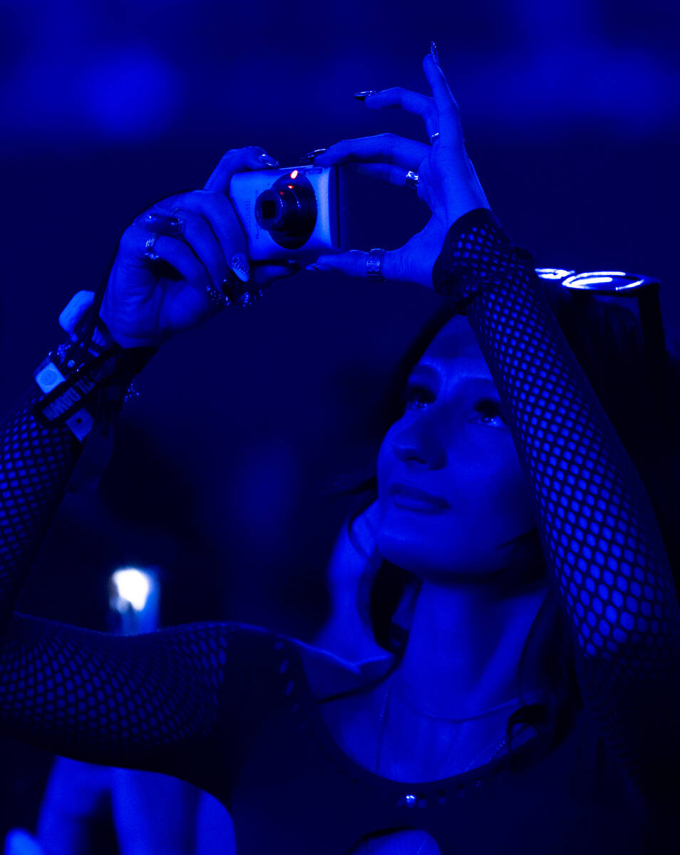 Concert goers take photos before the start of The Weeknd’s After Hours Til Dawn show Sat ...