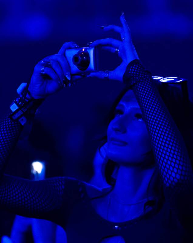 Concert goers take photos before the start of The Weeknd’s After Hours Til Dawn show Sat ...