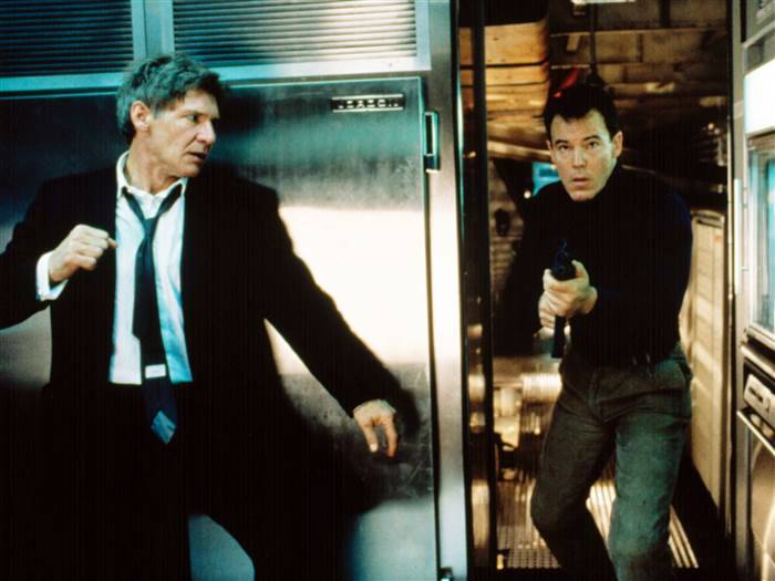 Harrison Ford, left, as the U.S. president, prepares to take out a terrorist in "Air Force One" ...