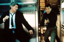 Harrison Ford, left, as the U.S. president, prepares to take out a terrorist in "Air Force One" ...
