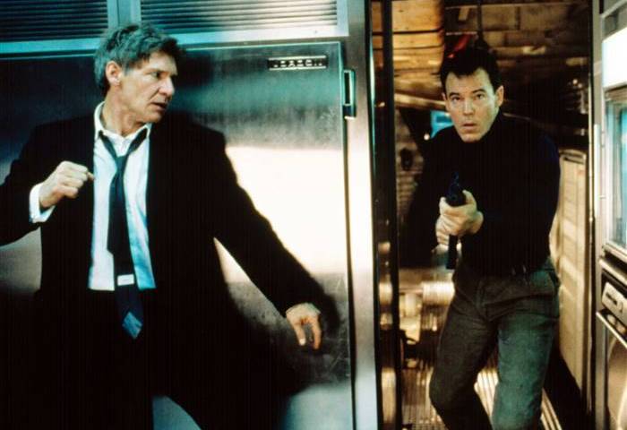 Harrison Ford, left, as the U.S. president, prepares to take out a terrorist in "Air Force One" ...