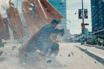 David Corenswet’s Man of Steel has his hands full in a scene from “Supermanȁ ...