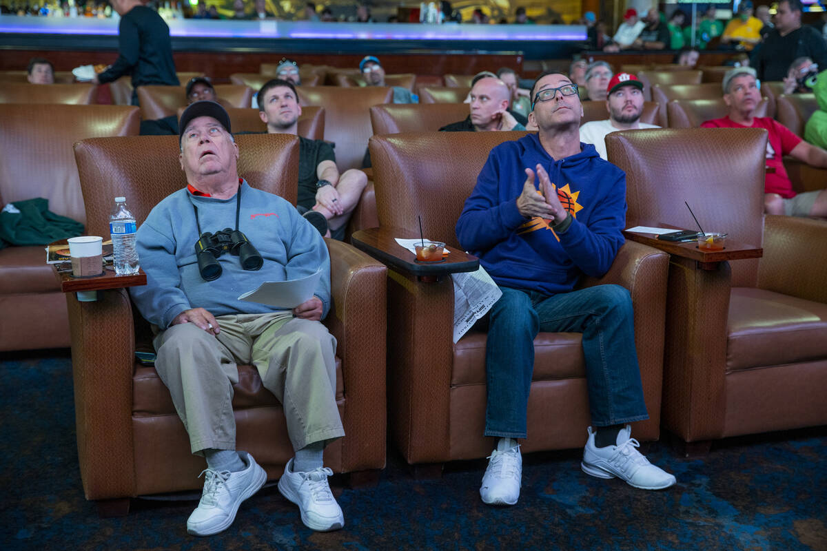Fans look to the big screens as March Madness begins in the Superbook at Westgate on Thursday, ...