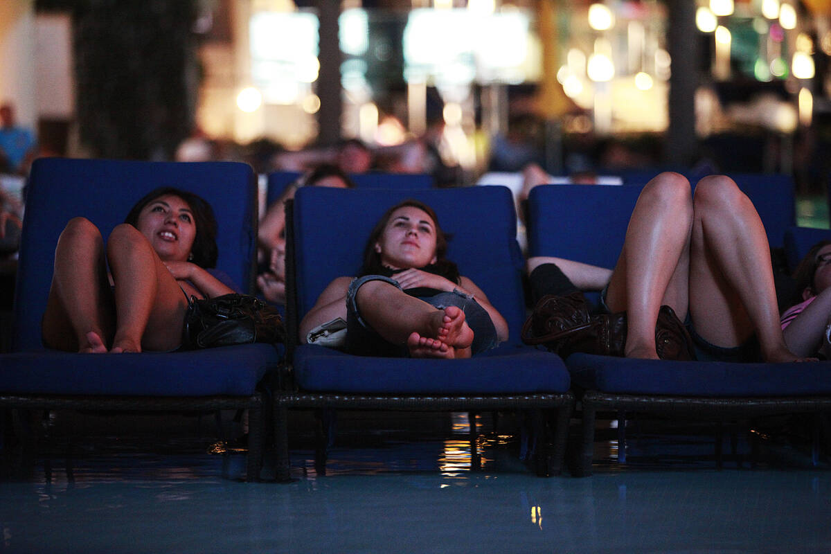 Guests watch the classic water-eat'em-up movie "Jaws" during Dive-In Movie Monday at The Boulev ...