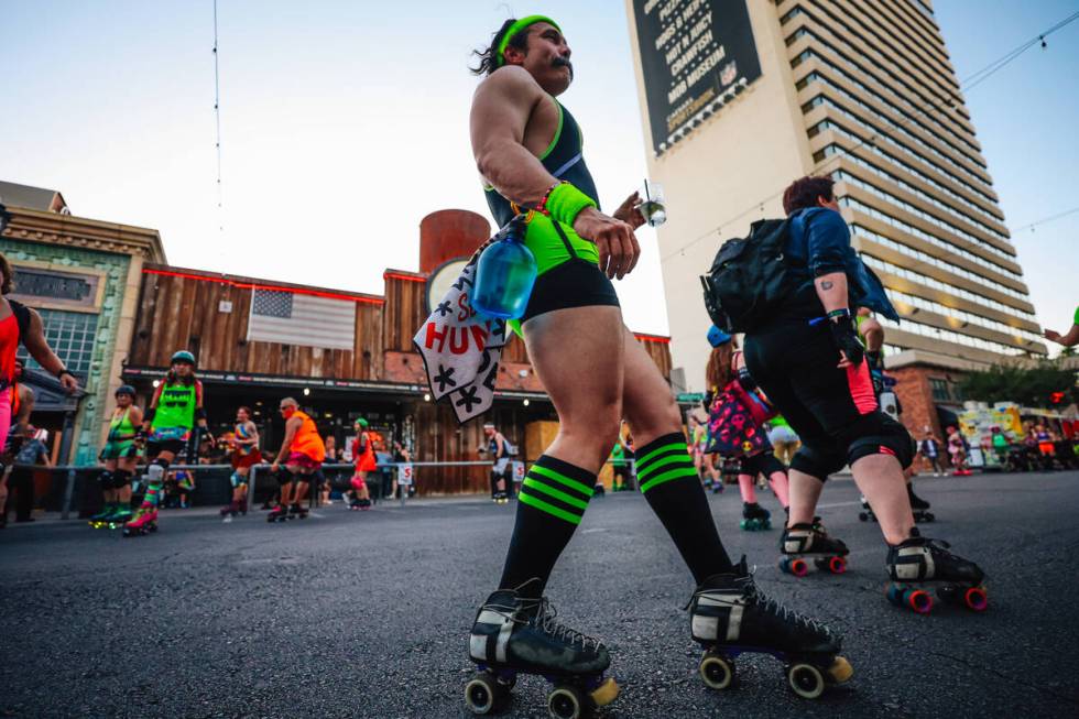 Roller skaters skate outside the Downtown Grand during RollerCon Wednesday, July 9, 2025, in La ...