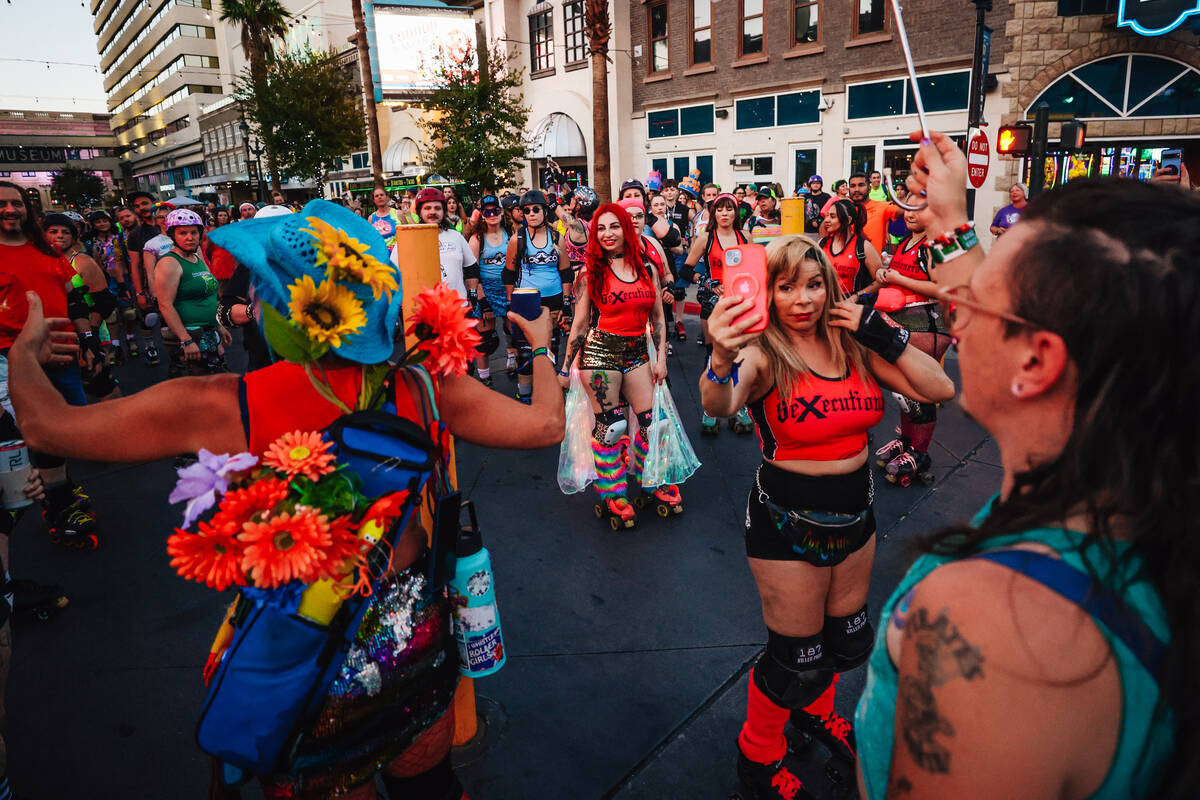Skaters get ready to take off during a sunset skate in front of the Downtown Grand during Rolle ...