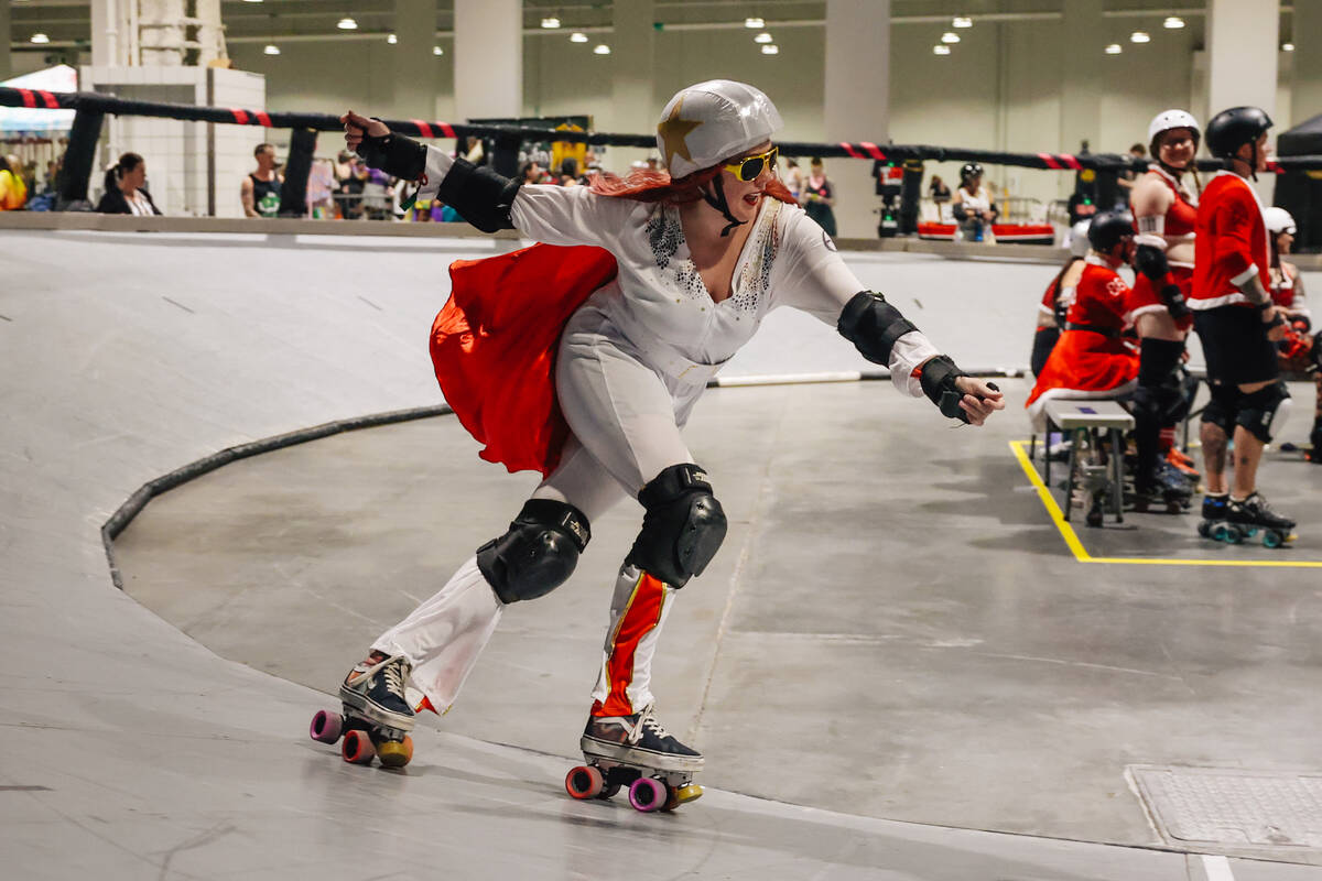 A roller derby participant dressed as Elvis laps the rink during RollerCon at the World Market ...