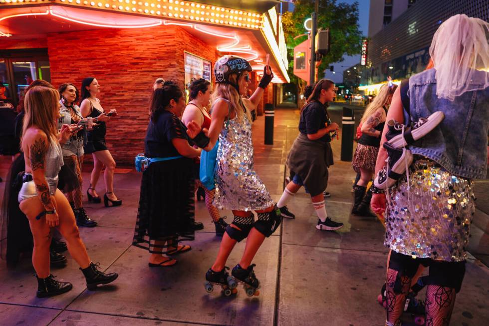 A derby wedding participant dances during a processional as they approach Plaza during RollerCo ...