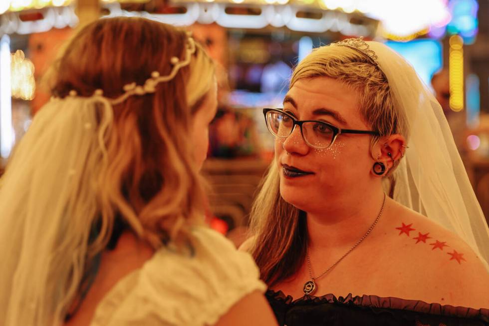 Derby wedding couples recite their vows during the RollerCon derby wedding outside of Plaza Thu ...