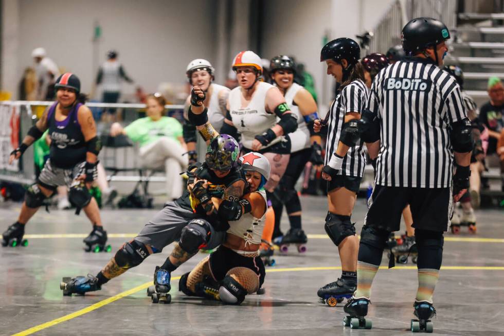 Derby players get into a fight during RollerCon at the World Market Center Thursday, July 10, ...