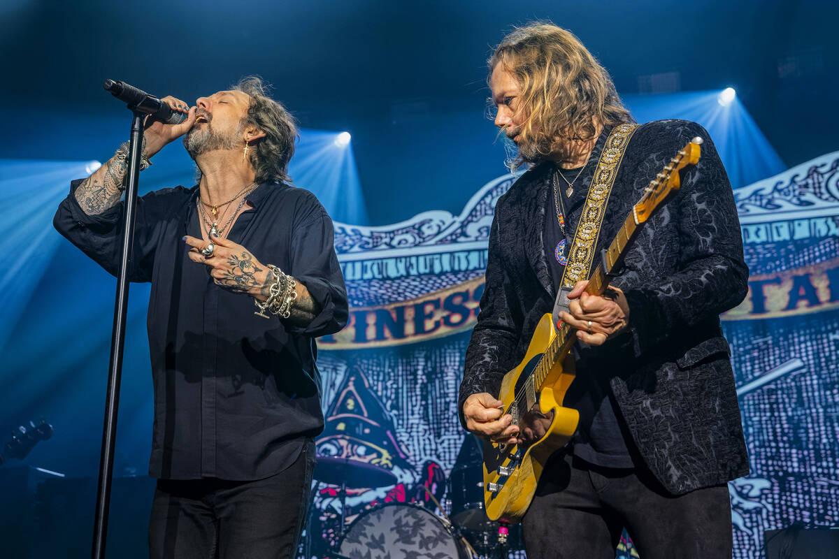 Chris Robinson, left, and Rich Robinson of The Black Crowes perform on Friday, Oct. 25, 2024, a ...