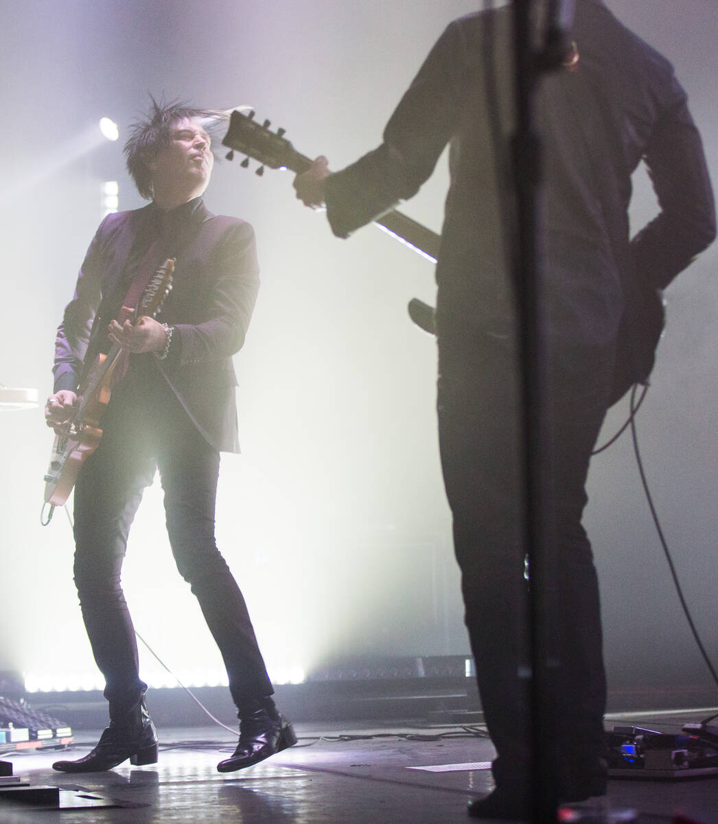 Queens of the Stone Age guitarist Troy Van Leeuwen, left, performs at The Chelsea at The Cosmop ...