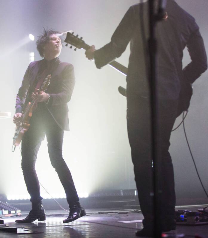 Queens of the Stone Age guitarist Troy Van Leeuwen, left, performs at The Chelsea at The Cosmop ...