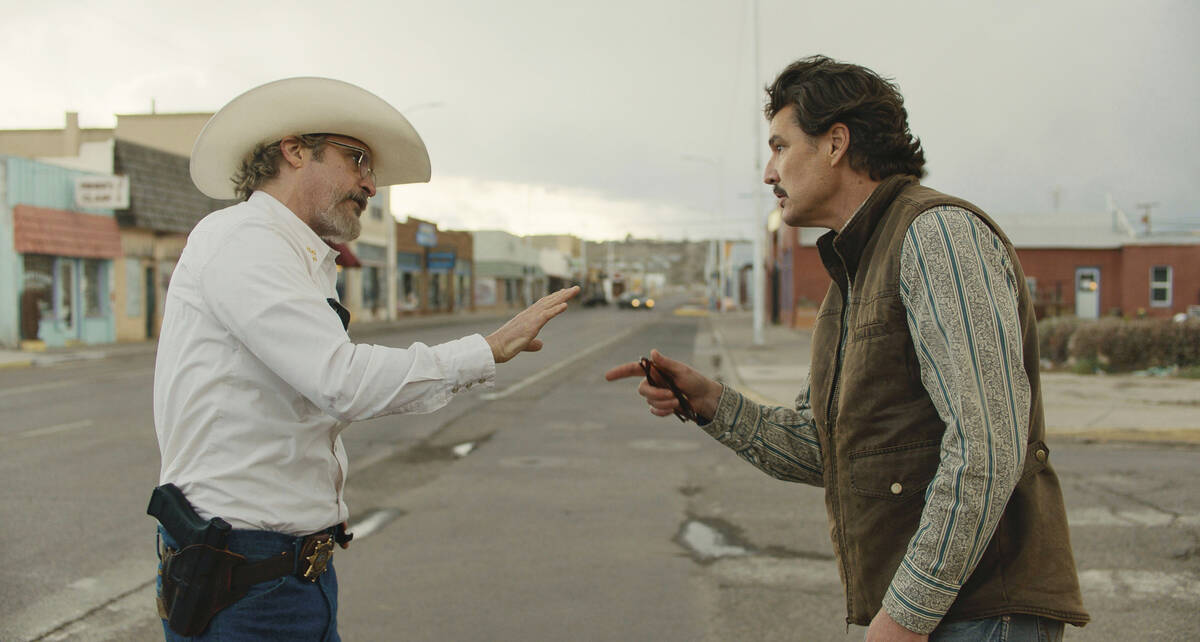 This image released by A24 shows Joaquin Phoenix, left, and Pedro Pascal in a scene from " ...