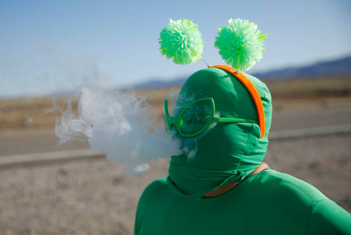 Audrie Clark smokes a vape outside of the Storm Area 51 Basecamp event Friday, Sept. 20, 2019, ...