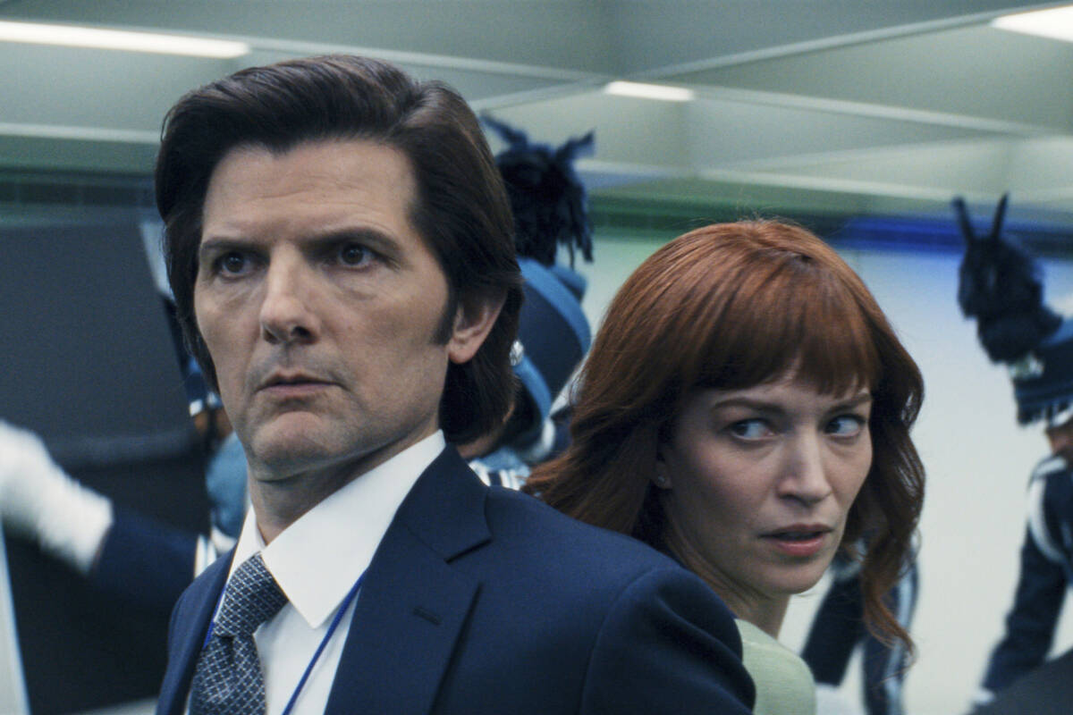 This image released by Apple TV+. shows Adam Scott, left, and Britt Lower in a scene from &quot ...