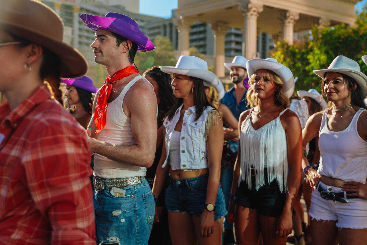 Dancers wait for their queue to join in during a fan line dance to Beyonce’s “Tex ...