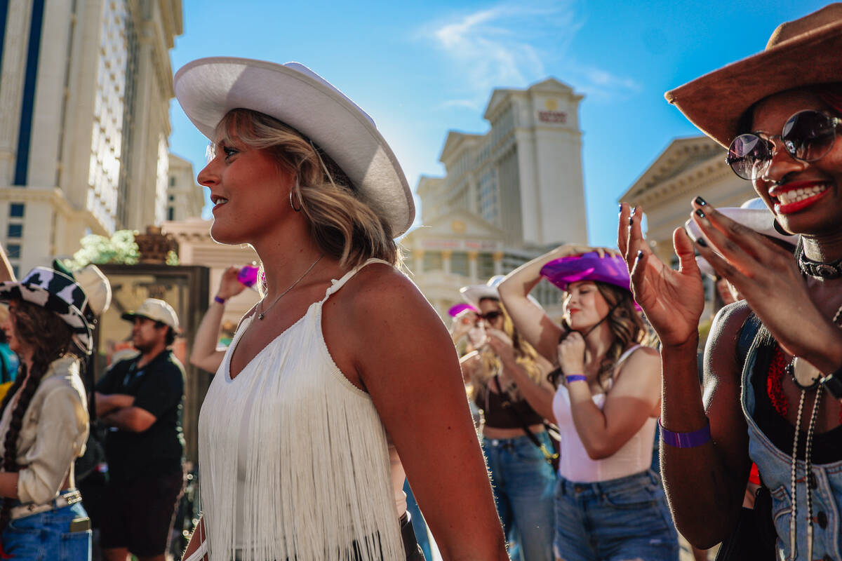 Dancers wait for their queue to join in during a fan line dance to Beyonce’s “Tex ...