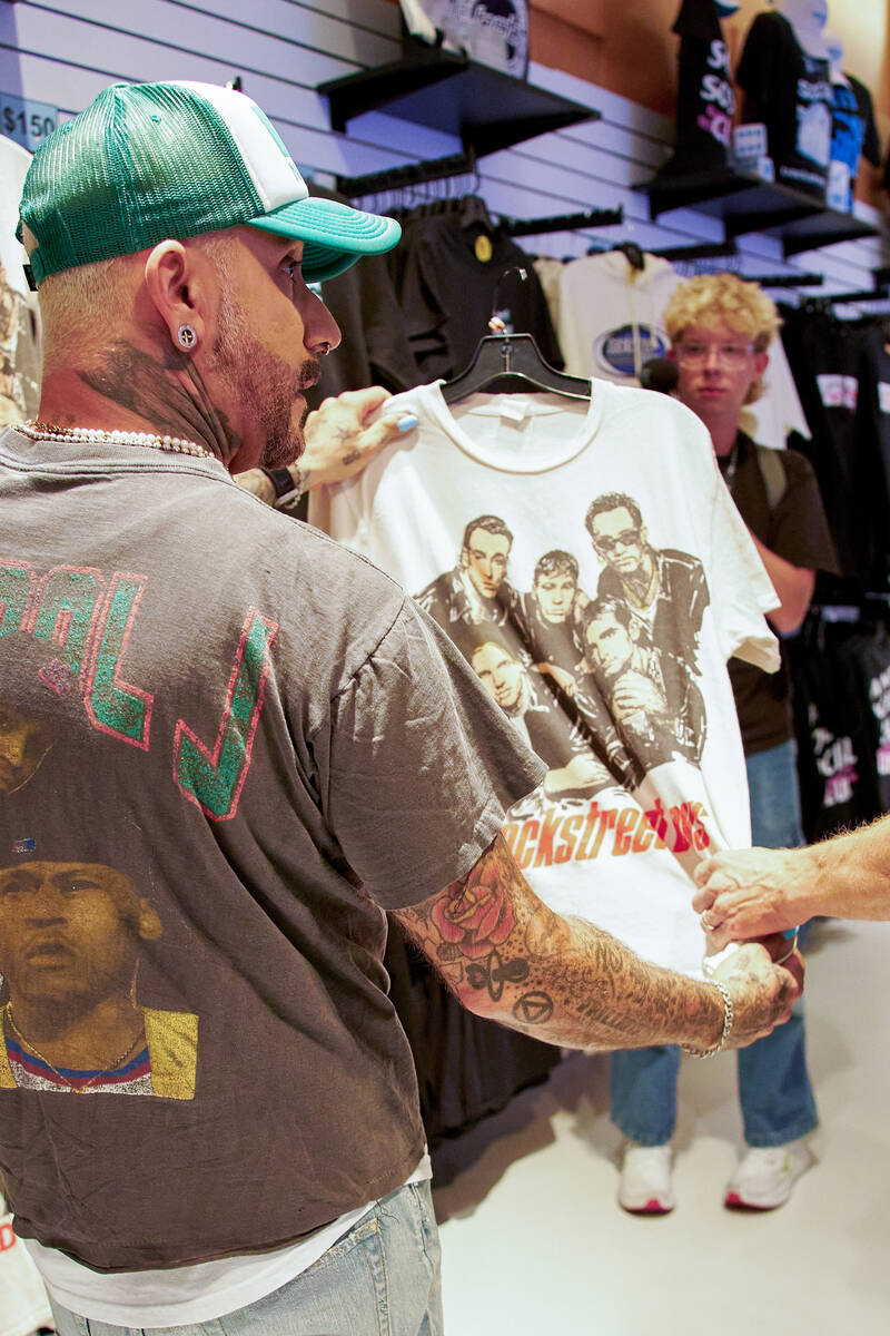 AJ McLean checks out a shirt available for sale at the Backstreet Boys Terminal, a new immersiv ...