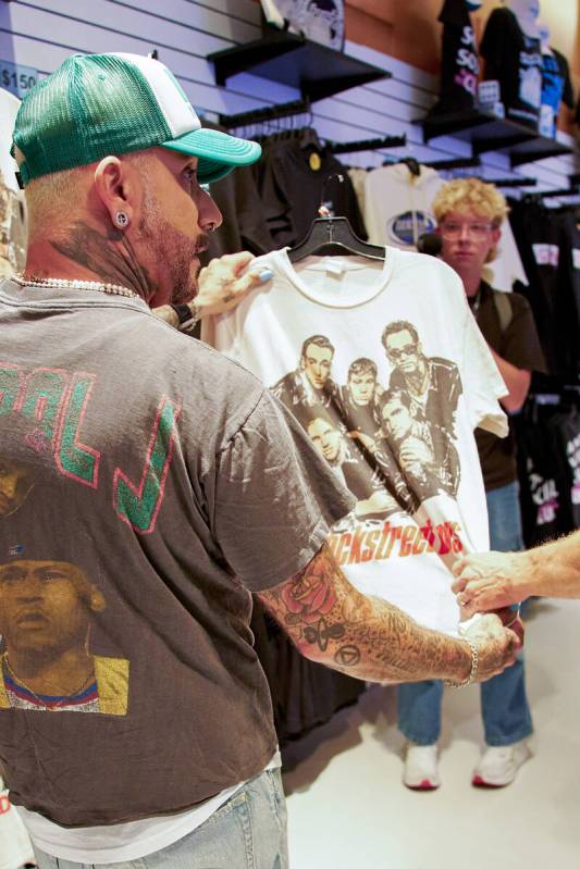 AJ McLean checks out a shirt available for sale at the Backstreet Boys Terminal, a new immersiv ...