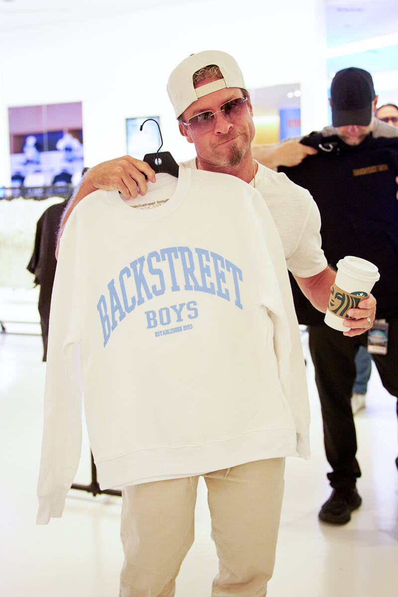 Brian Littrell holds up a Backstreet Boys sweatshirt at the Backstreet Boys Terminal, a new imm ...