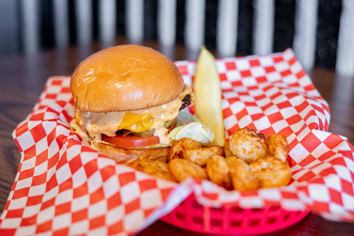 A cheeseburger and tots from The Stadium Sports Bar and Restaurant, a new spot as of summer 202 ...