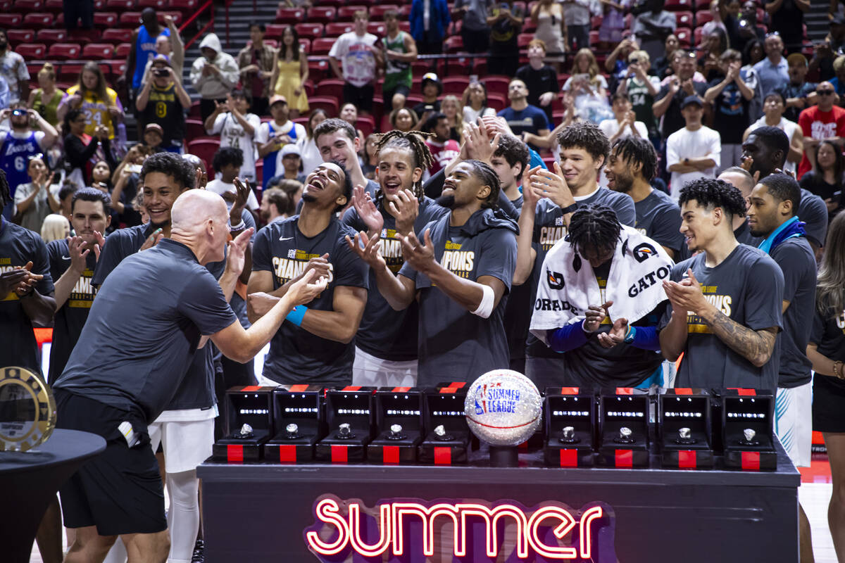 The Charlotte Hornets celebrate their victory over the Sacramento Kings in the NBA Summer Leagu ...