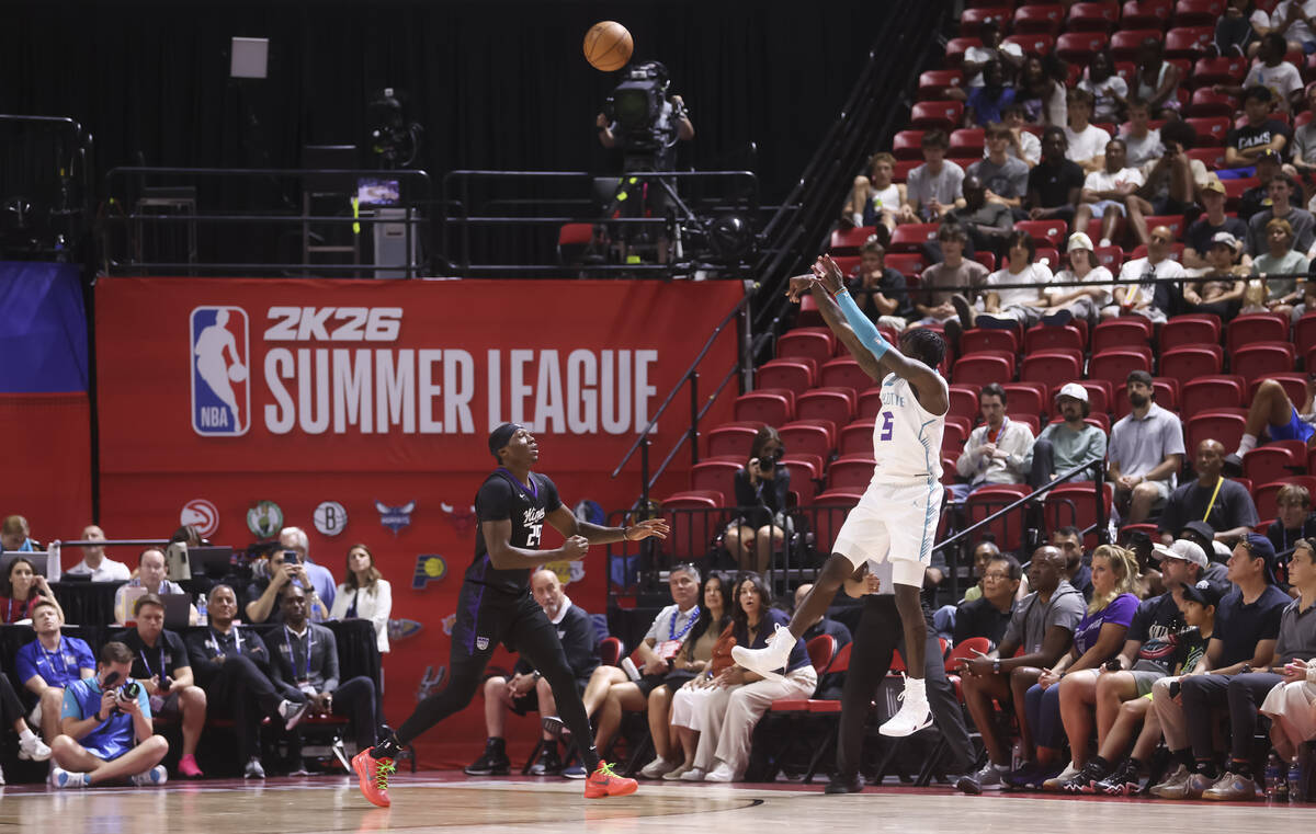 Charlotte Hornets guard Damion Baugh (5) shoots over Sacramento Kings guard/forward Daeqwon Plo ...
