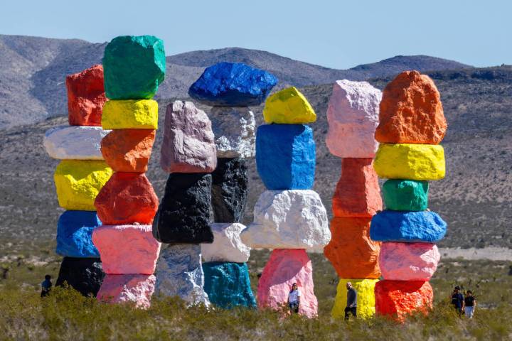 Visitors stop by to see the Seven Magic Mountains art installation on Wednesday, March 20, 2024 ...