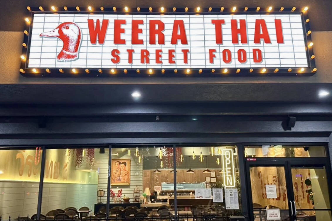 The exterior of Street Food by Weera Thai glows on West Sahara Avenue in Las Vegas. (Street Foo ...