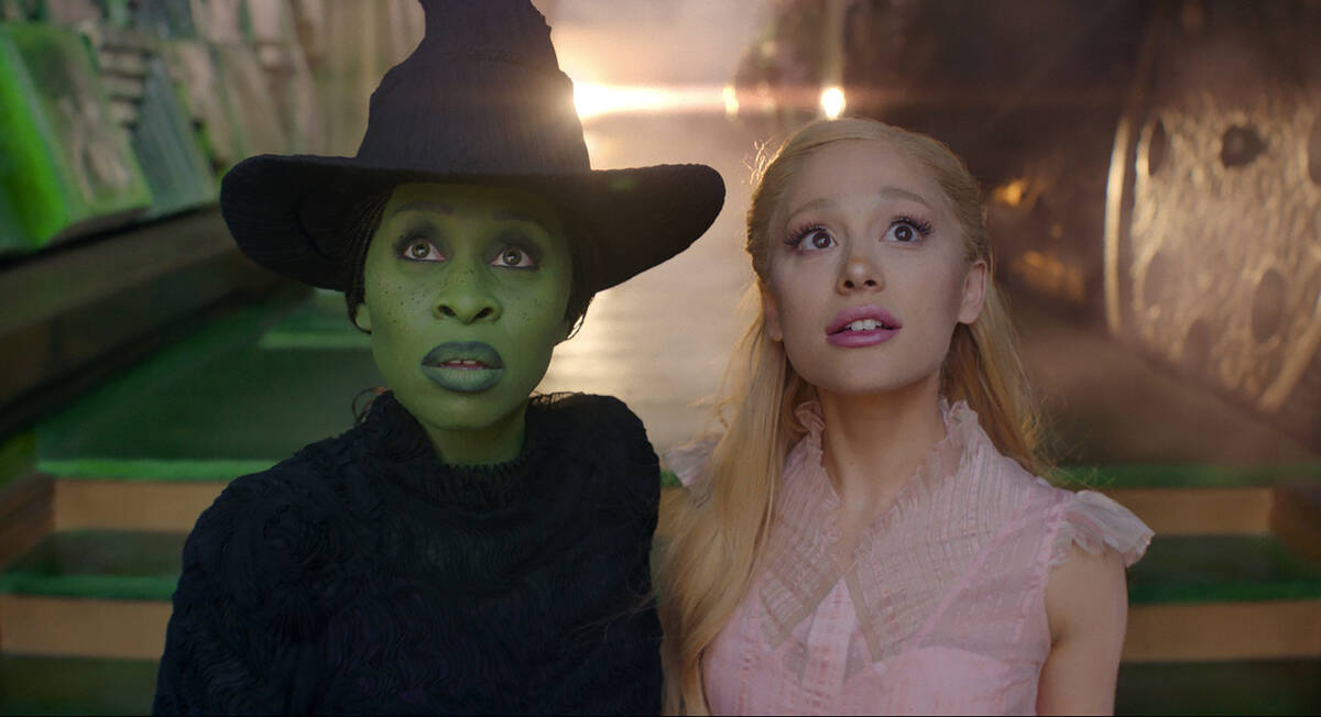 This image released by Universal Pictures shows Cynthia Erivo, left, and Ariana Grande in a sce ...