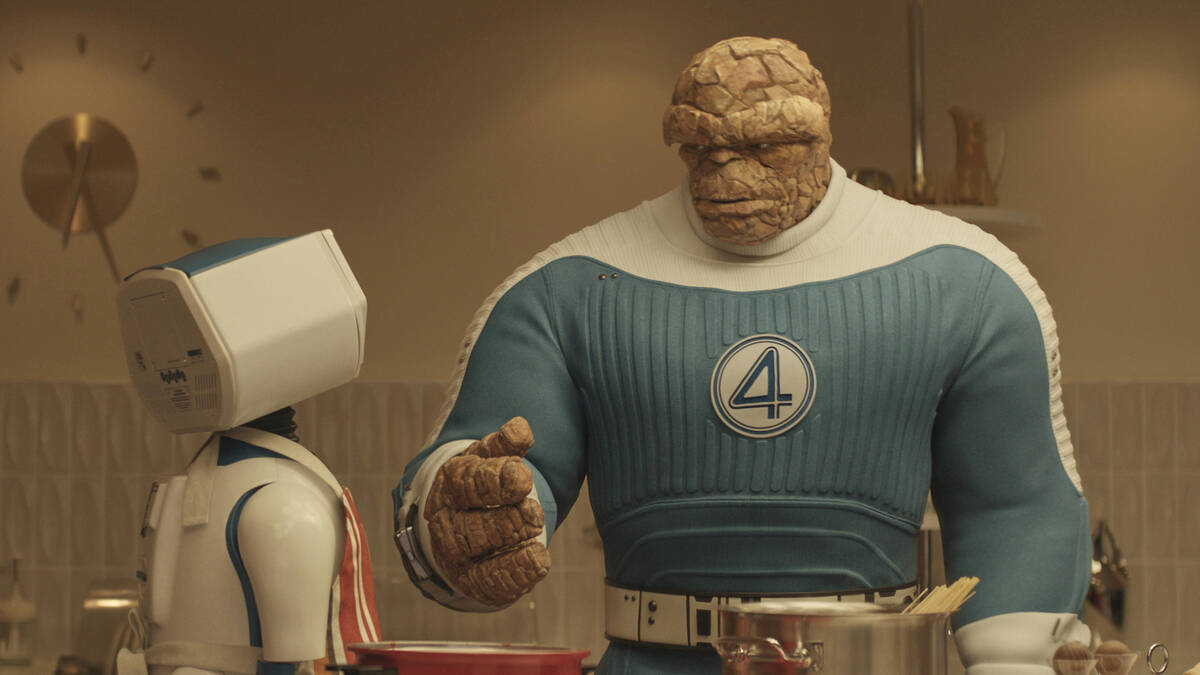 This image released by Disney shows H.E.R.B.I.E, left, and The Thing, portrayed by Ebon Moss-Ba ...