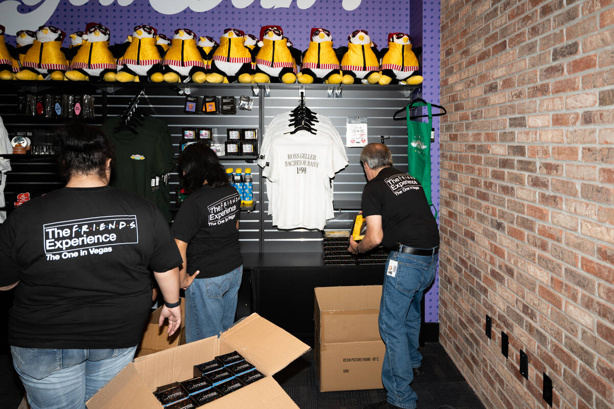 Staff stock shelves in the gift shop during the ribbon cutting of The FRIENDS Experience: The O ...