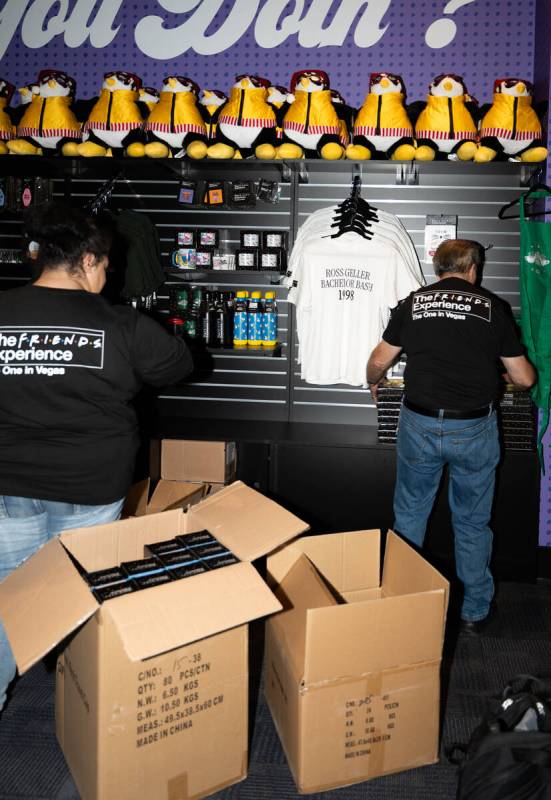 Staff stock shelves in the gift shop during the ribbon cutting of The FRIENDS Experience: The O ...