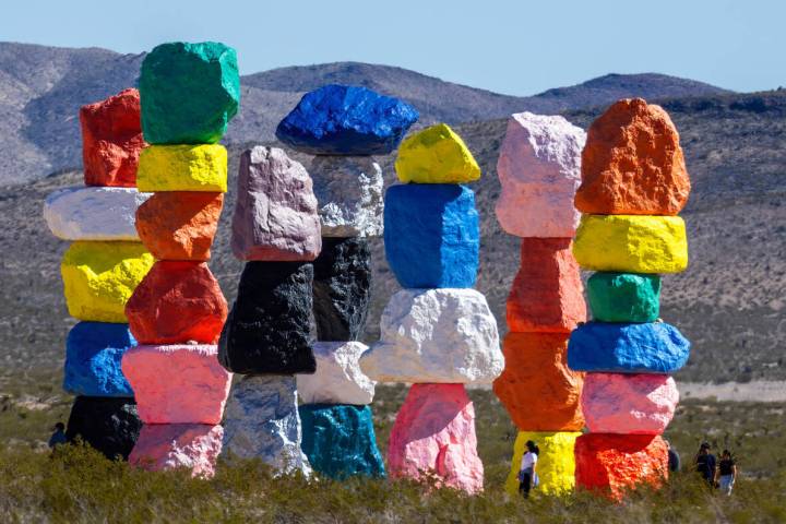 Visitors stop by to see the Seven Magic Mountains art installation on Wednesday, March 20, 2024 ...