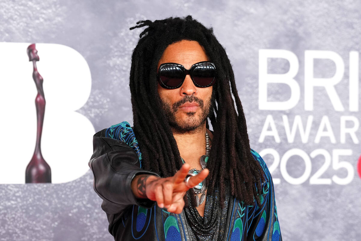 Lenny Kravitz poses for photographers upon arrival at the Brit Awards 2025 in London, Saturday, ...