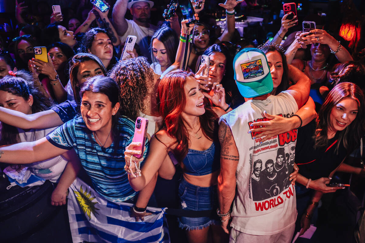Backstreet Boys member Brian Littrell hugs fans during the Backstreet Boys’ shrunken hea ...