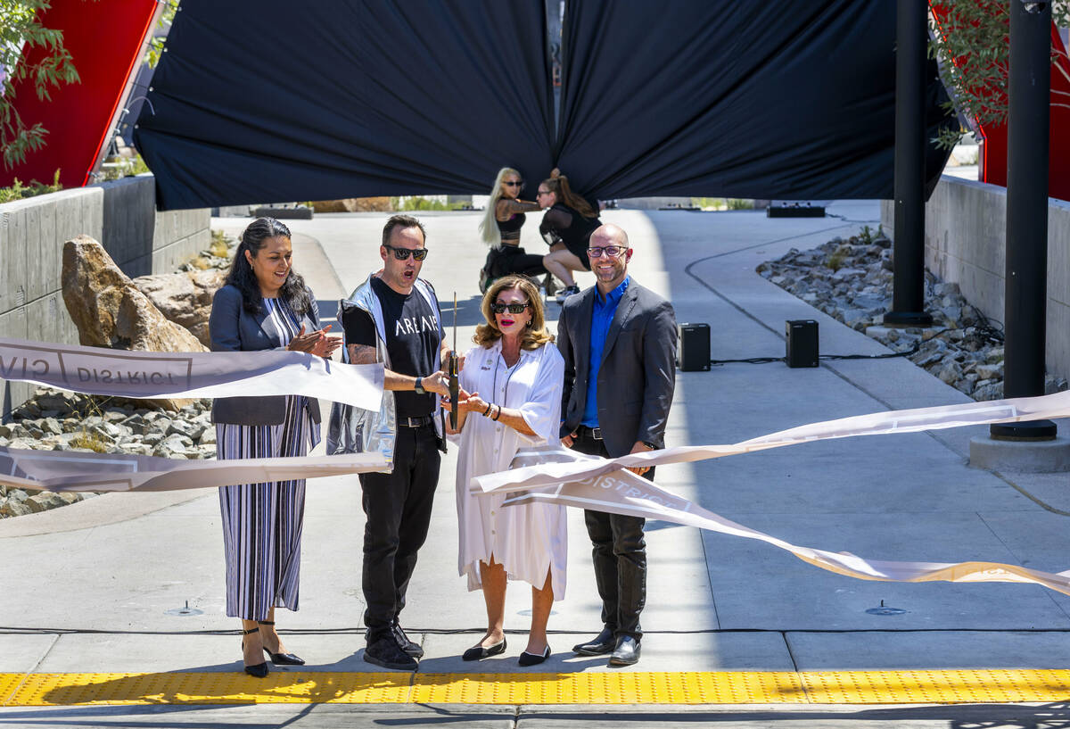 Ward 3 Councilwoman Olivia Díaz, Winston Fisher, AREA15’s chief executive officer, ...
