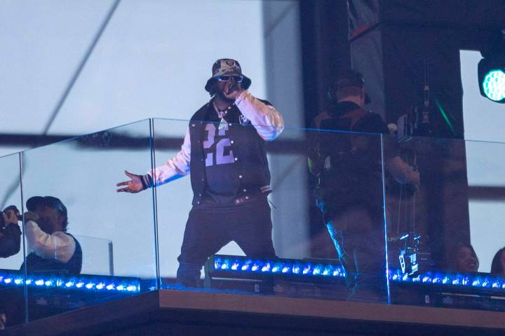 Rapper T-Pain performs during halftime of an NFL game between the Raiders and the New England P ...