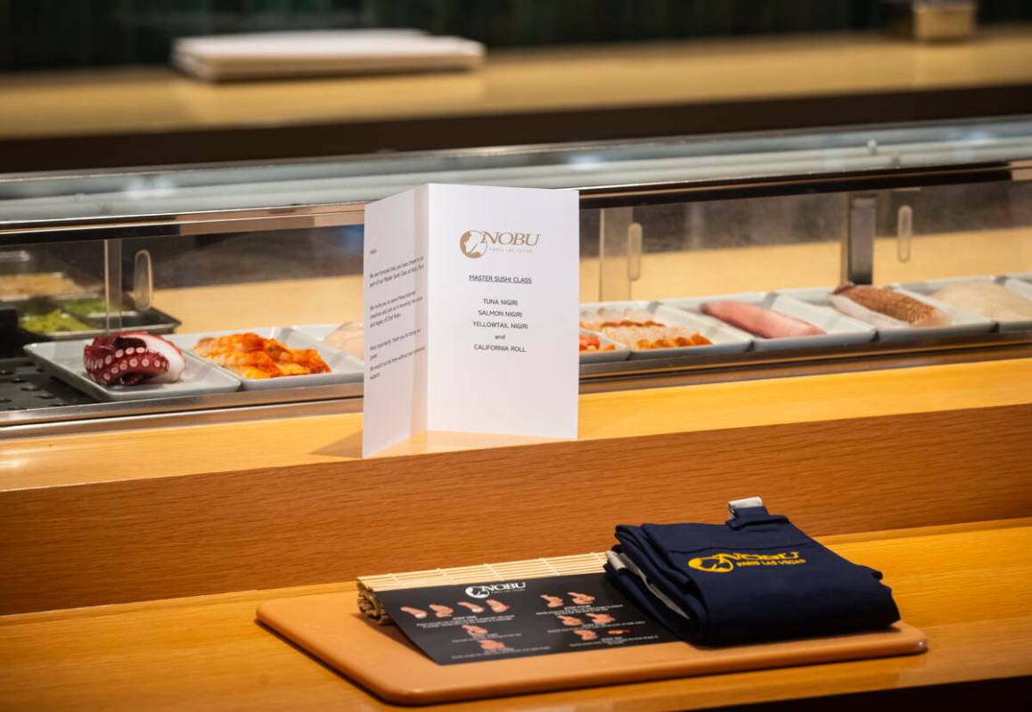 A place setting for the sushi-making class at Nobu, complete with a cutting board and apron, ar ...