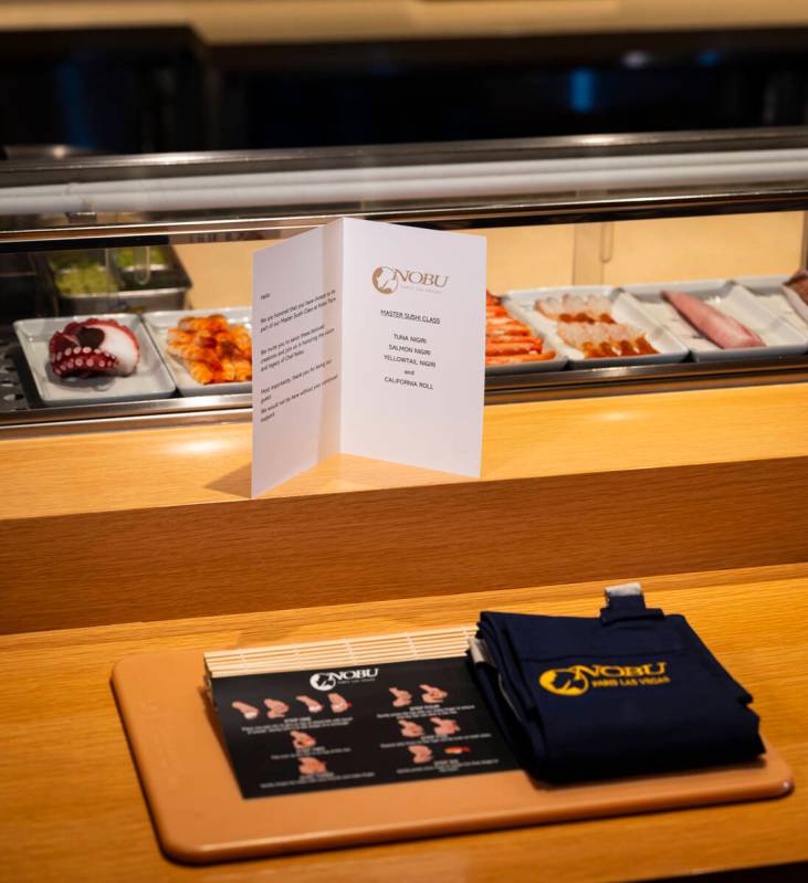 A place setting for the sushi-making class at Nobu, complete with a cutting board and apron, ar ...