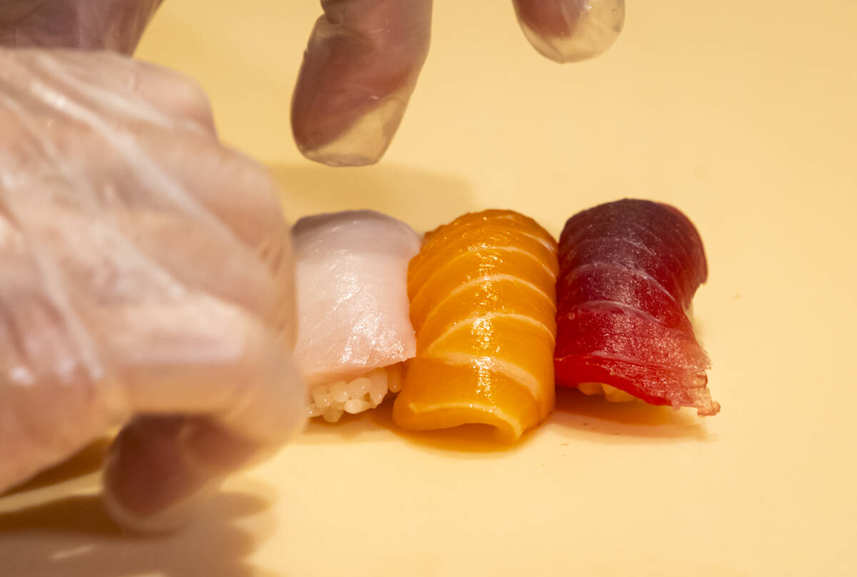 Tuan Pham, sous chef at Nobu, prepares nigiri in a sushi-making class demonstration at Nobu at ...