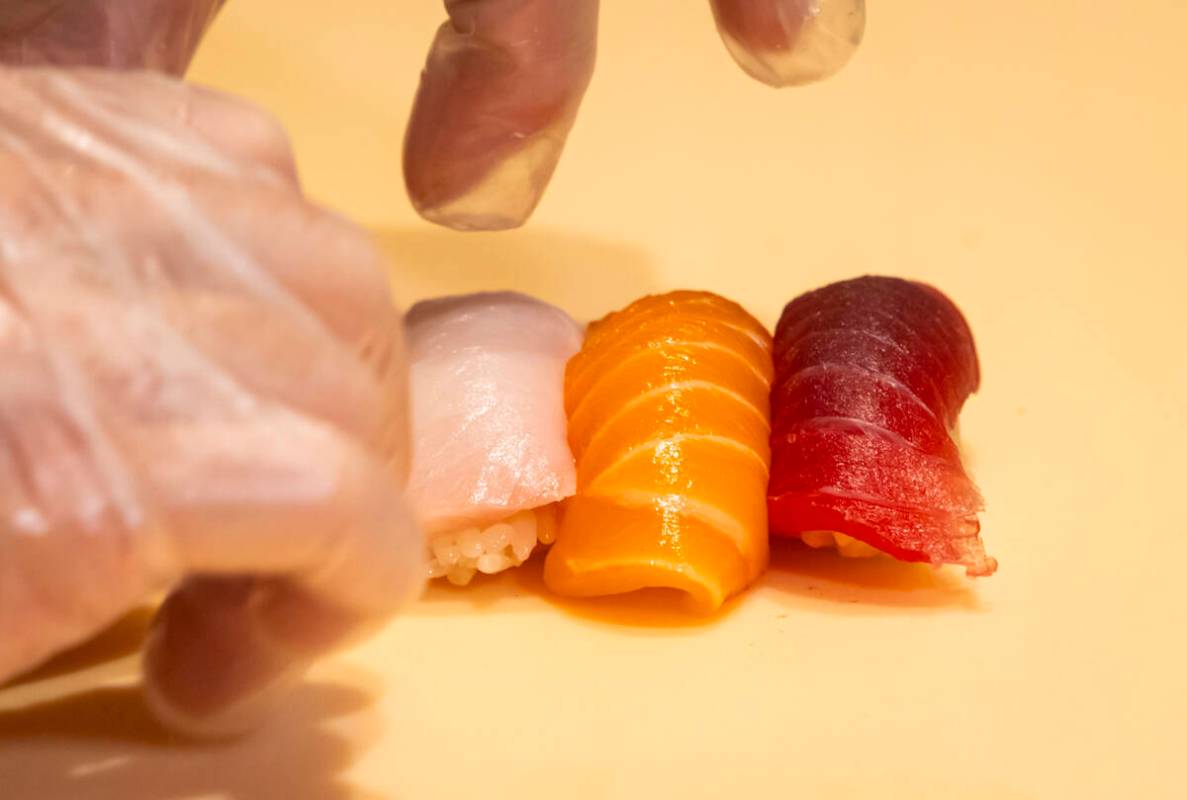 Tuan Pham, sous chef at Nobu, prepares nigiri in a sushi-making class demonstration at Nobu at ...