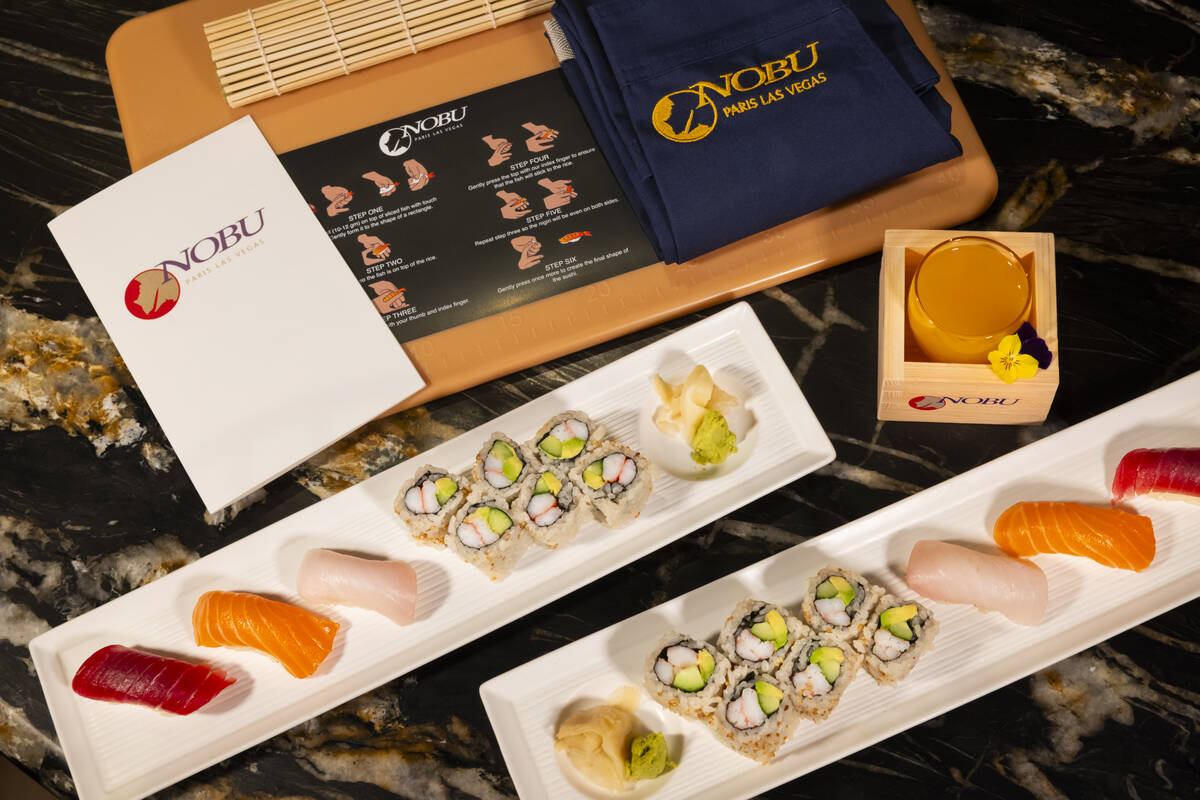 Tuna, salmon and yellowtail nigiri is seen alongside a California roll, prepared by Nobu sous c ...