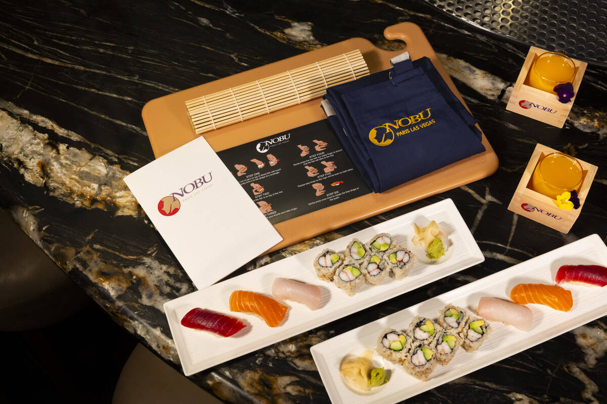 Tuna, salmon and yellowtail nigiri is seen alongside a California roll, prepared by Nobu sous c ...